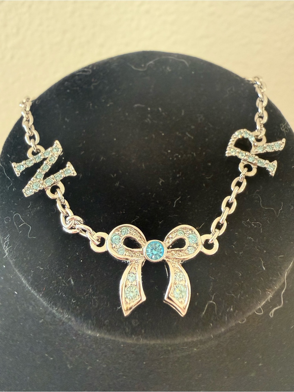 Nina Ricci Bow Pendant Necklace with Aqua Crystals